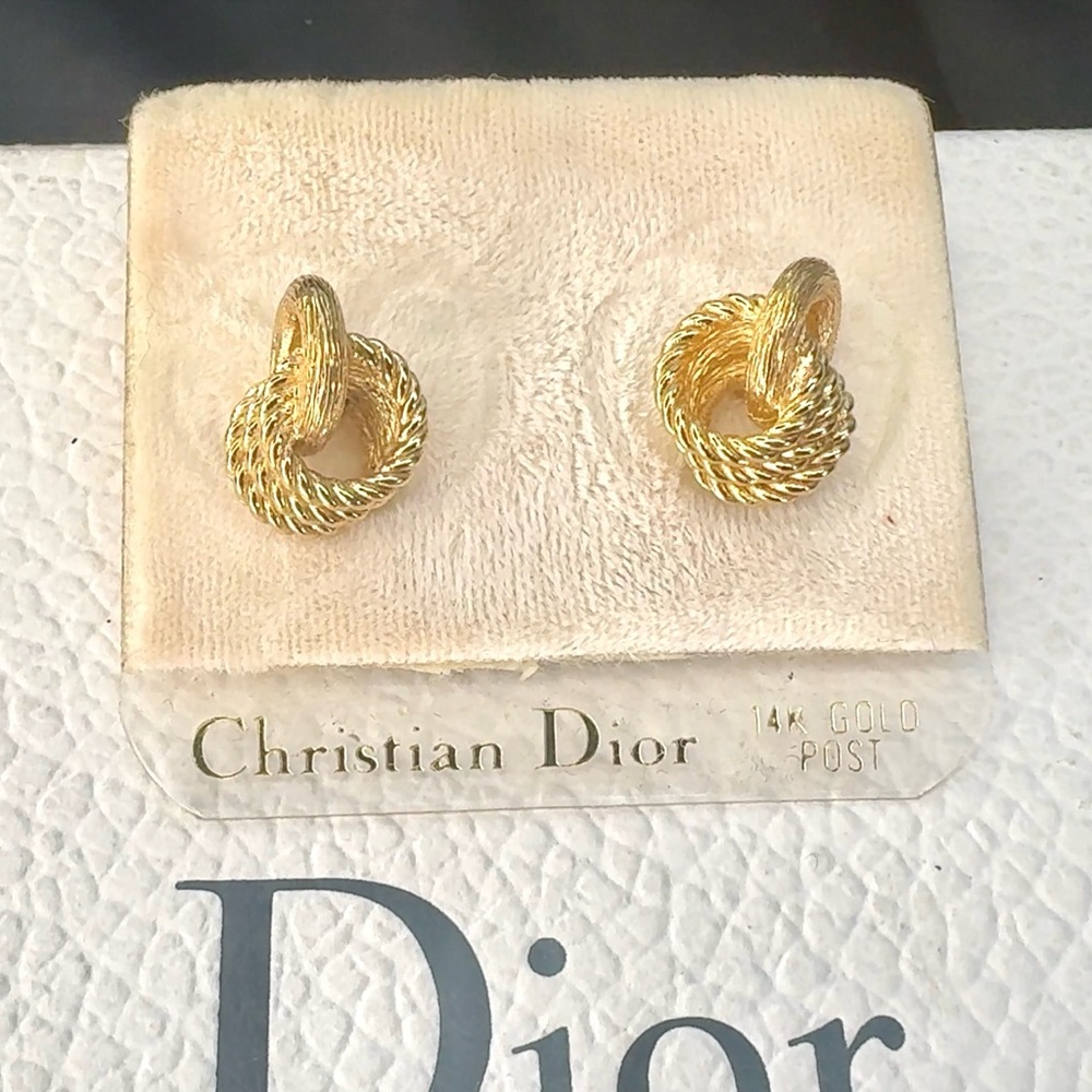 CHRISTIAN DIOR 14k yellow gold post earrings with knot design pierced ears.